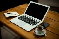 MacBook_Air_on_brown_wooden_table-Alejandro_Escamilla-5000x3333-N7XodRrbzS0.jpg